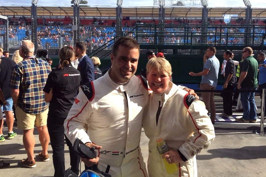 Lynda Britten with former F1 driver Zsolt Baumgartner at the race track.