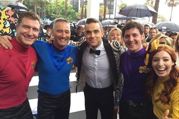 Robbie Williams and The Wiggles share a hug on the red carpet ahead of the ARIA Awards