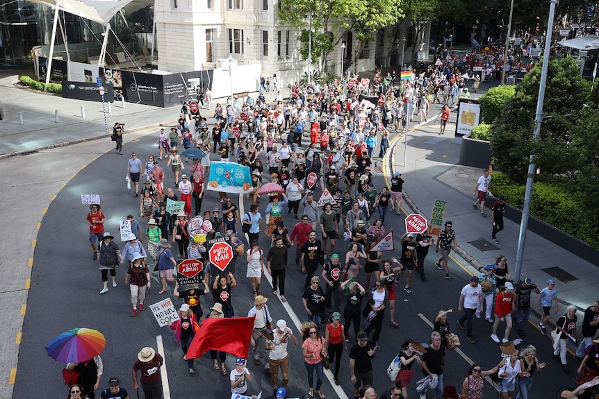 Hundreds of anti-Adani protestors march through Brisbane city.
