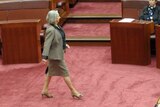 Liberal senator Sue Boyce crosses the Senate floor