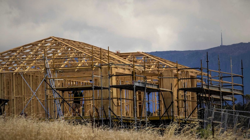 Wooden frame of a house under construction.