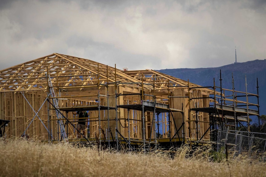 Wooden frame of a house under construction.