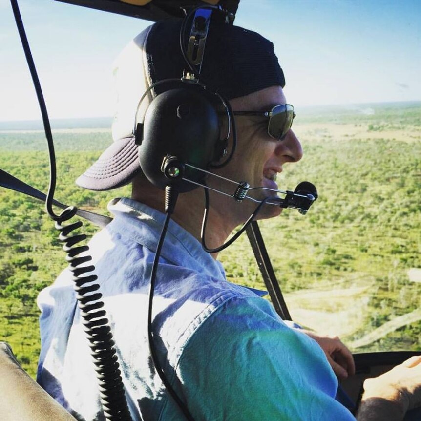 a man in a helicopter