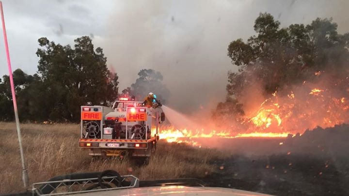Fire fighters battle flames