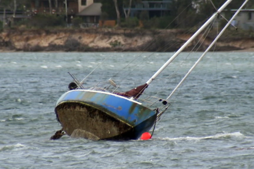 A yacht on its side at Dodges Ferry