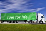 A computer generated image of a white truck towing a green trailer that reads 'Fuel for life'