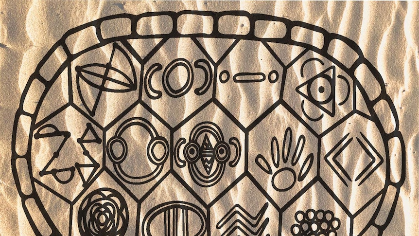 Indigenous drawing against a background of sand
