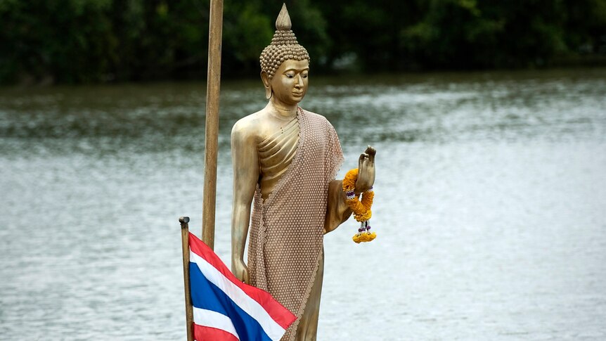 A Buddha statue stands above floodwater in Ayutthaya on September 13, 2011.