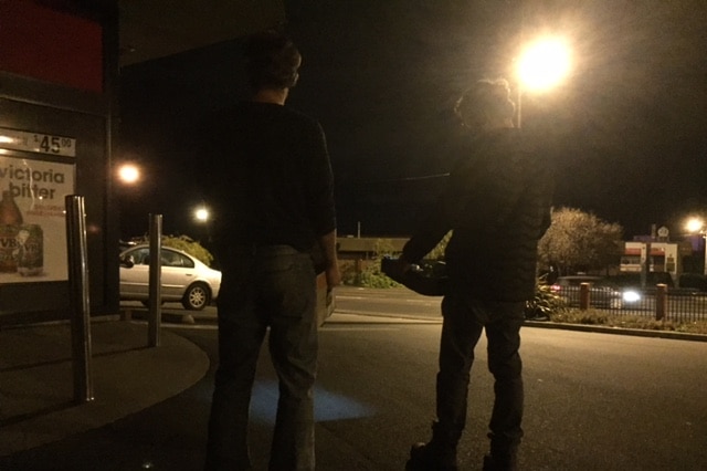 Students collecting food at night