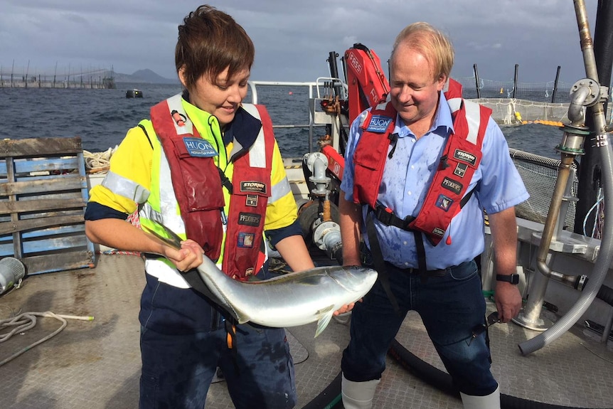 Elisha Lovell with Huon founder Peter Bender and a market-weight specimen.