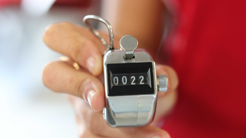 close up shot of manual clicker used to headcount tourists