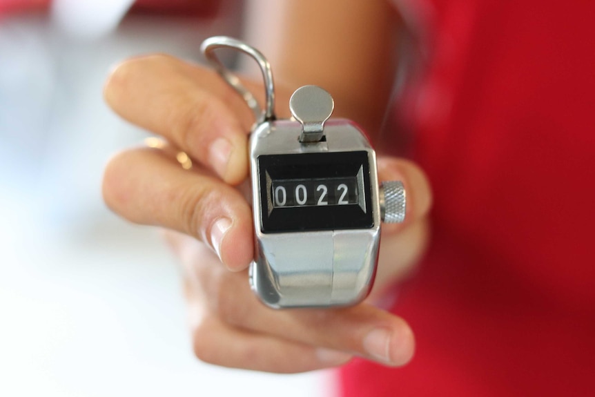 close up shot of manual clicker used to headcount tourists