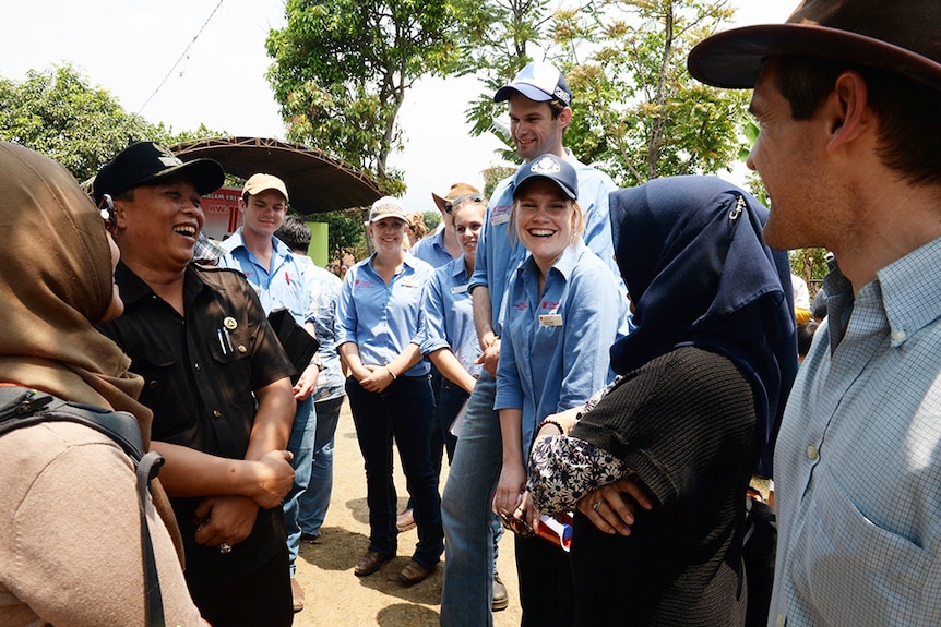 A large group of smiling men and women.