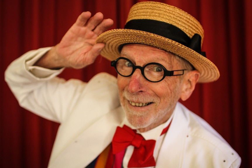 A close up of tap dancer David Watson in his straw hat.