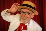 A close up of tap dancer David Watson in his straw hat.