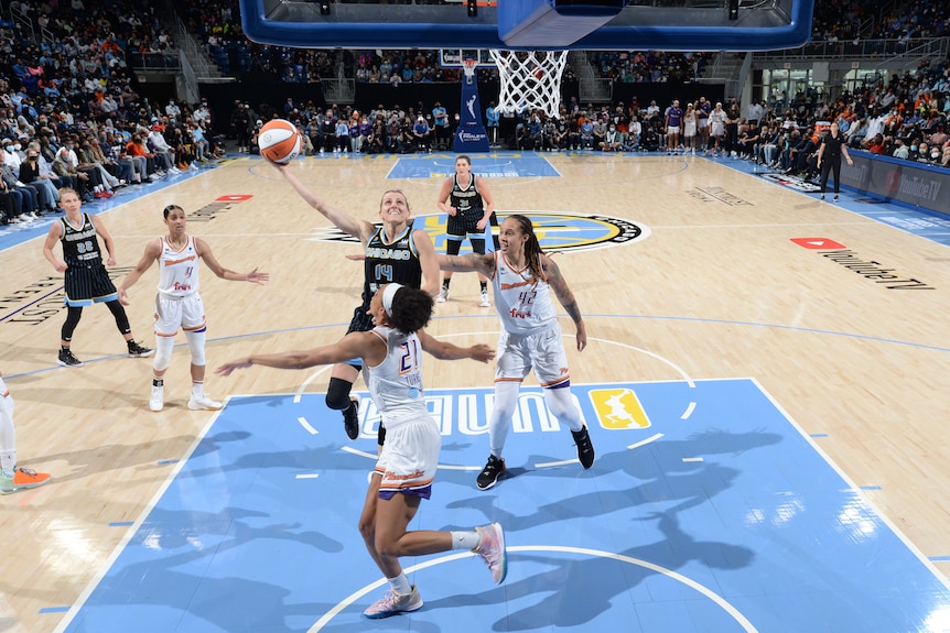 WNBA player driving to the basket during the championship game