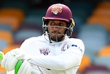 A Queensland Sheffield Shield batter plays a pull shot against Western Australia at the Gabba.