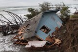 Storm washes away house on beach in US