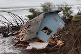 Storm washes away house on beach in US