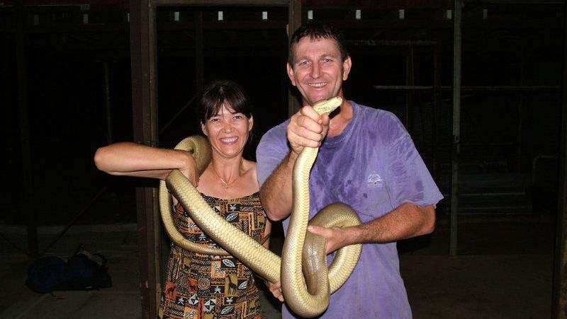 Allan and Natasha Brahminy holding a snake.