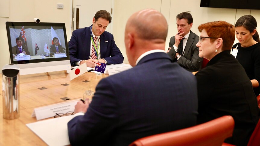 Marise Payne and Peter Dutton on video conferencing with Japanese counterparts.