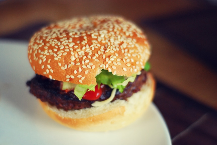 Hamburger sitting on a plate.