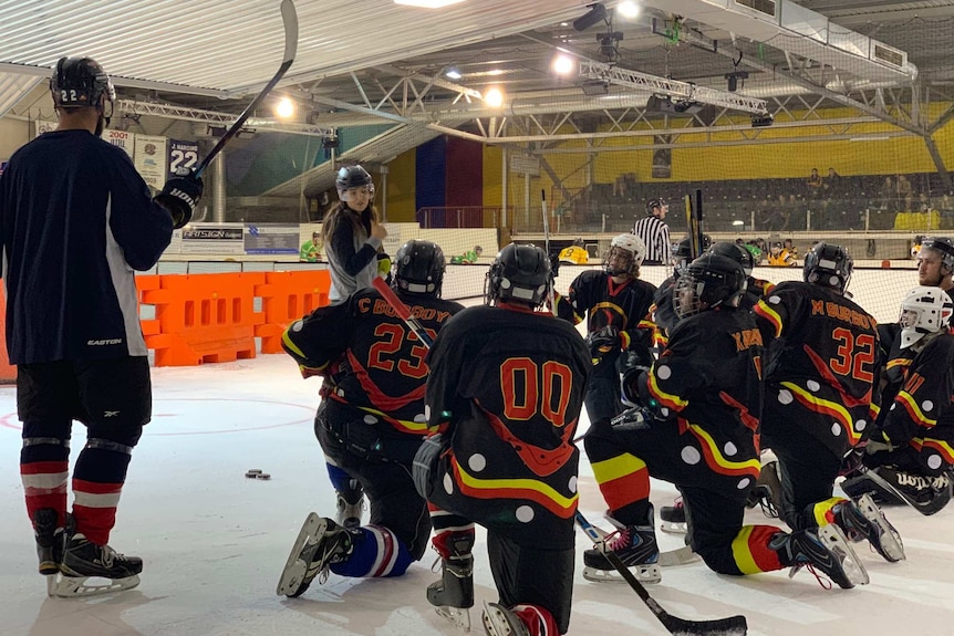 The Kaurna Boomerangs ice hockey team and their coach Justine Shaw.