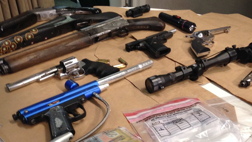 Some of the weapons, drugs and cash seized at Huntingdale.