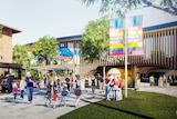 An artist impression of a club ground with Adelaide Crows colours and people walking
