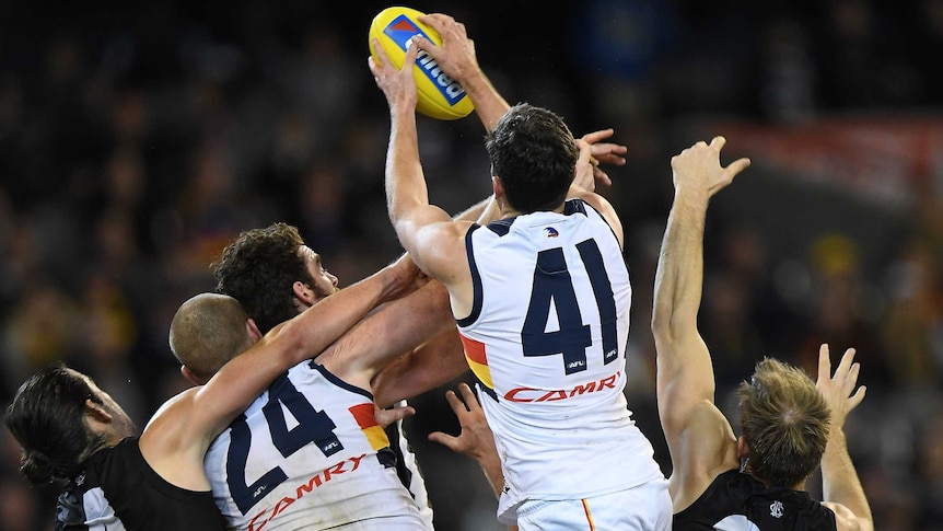 Mitch McGovern takes a huge pack mark for Adelaide.