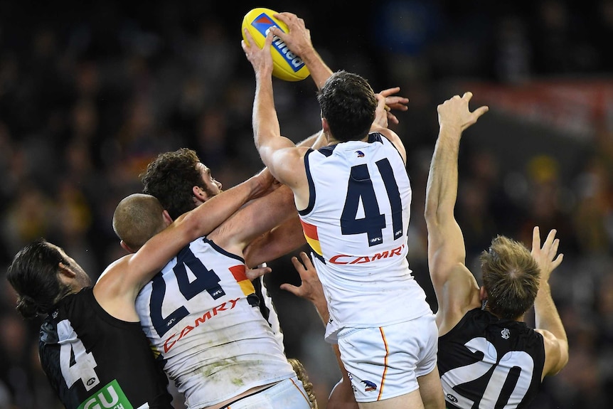 Mitch McGovern takes a huge pack mark for Adelaide.