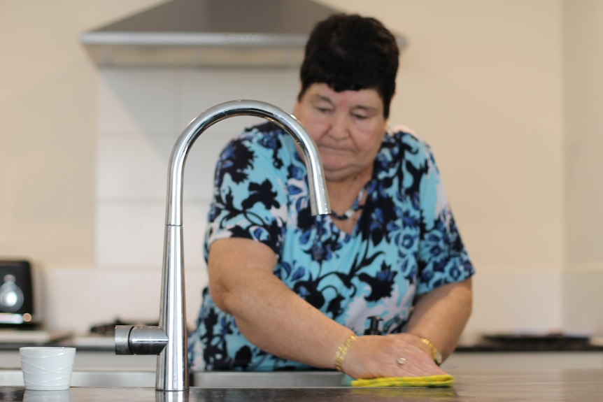 Jennifer Scattini cleaning in her kitchen