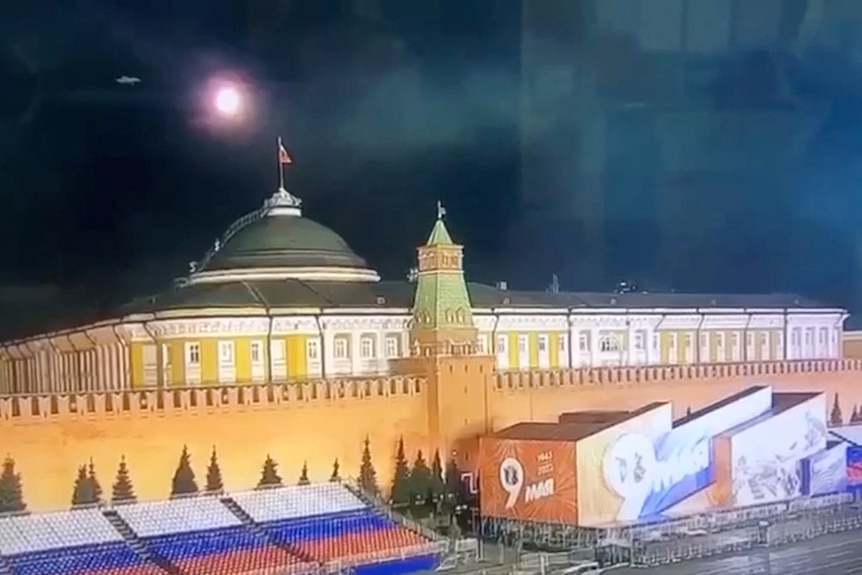 A ball of light explodes above the Kremlin's Senate building. 