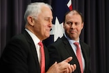 Josh Frydenberg smiles at Malcolm Turnbull during Blue Room press conference