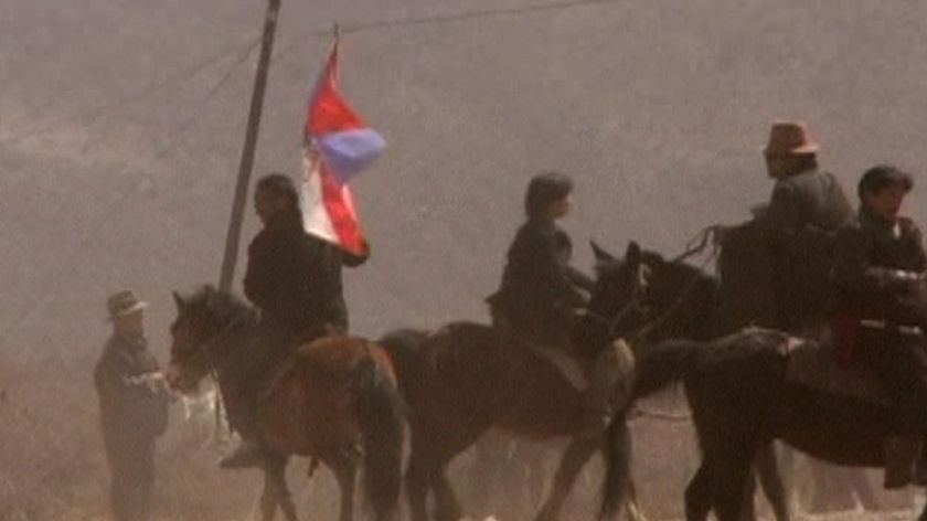 Tibetan protester on horseback in Gansu, China