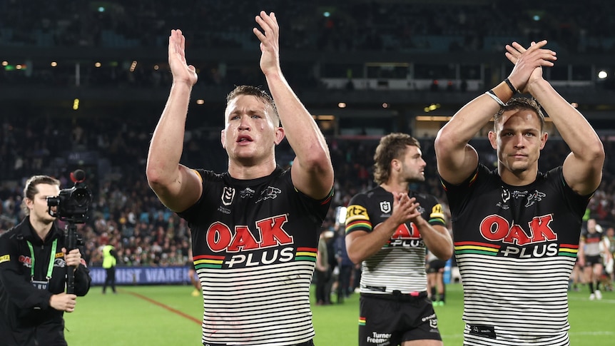 Two players applaud following a Panthers win