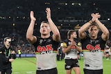 Two players applaud following a Panthers win
