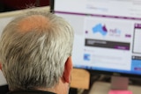 Man looks at the NDIS website
