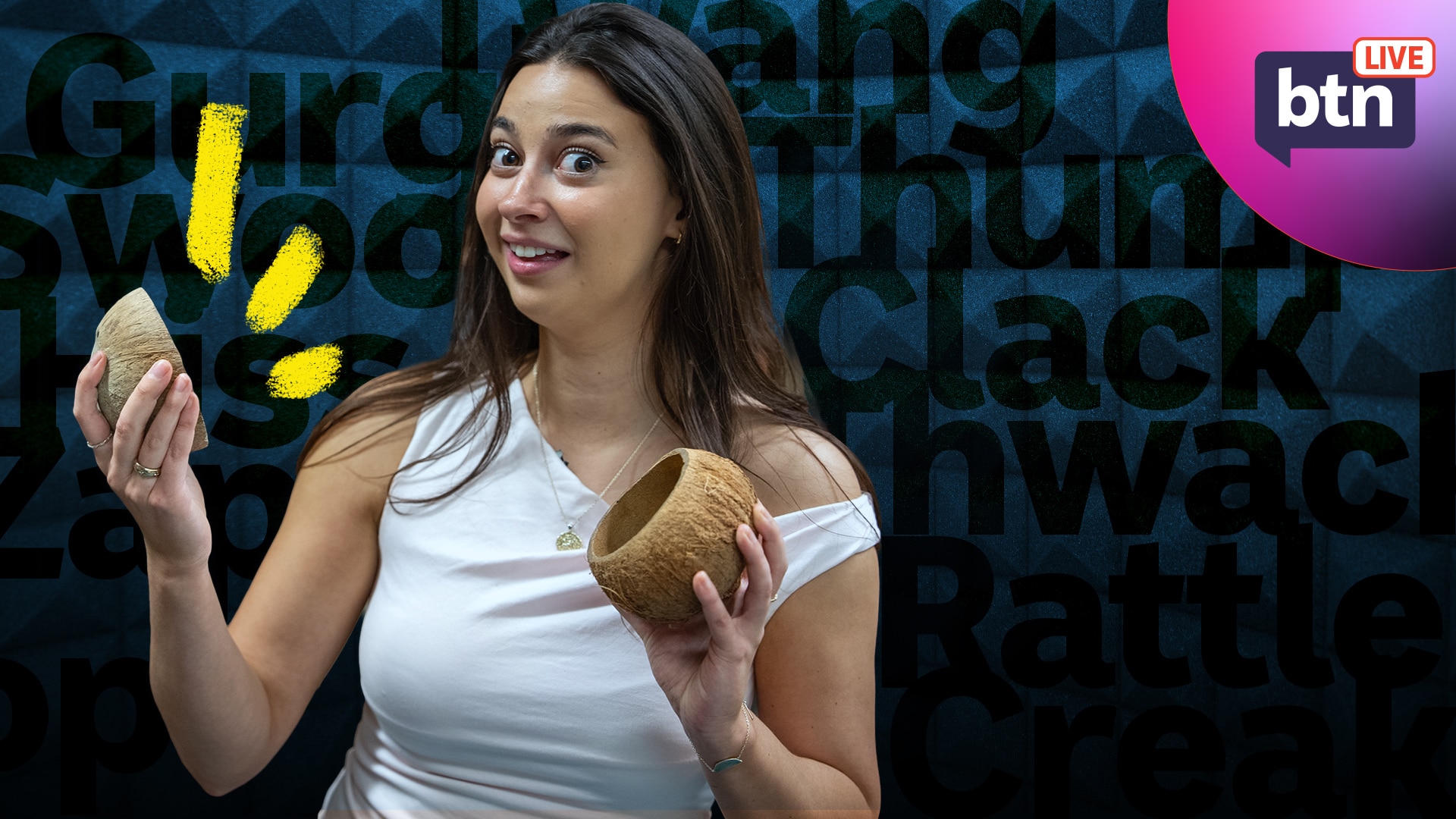 Wren looks excited as she holds half a coconut shell in each hand ready to make noise.