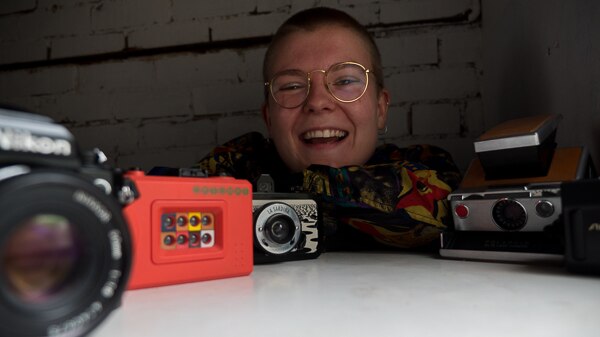 Ellie Anderson and a few of her film cameras.