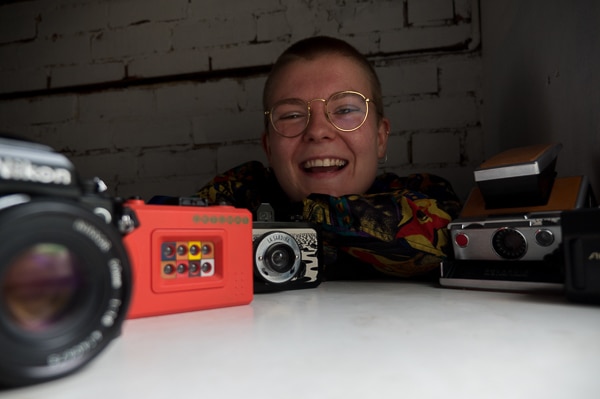 Ellie Anderson and a few of her film cameras.
