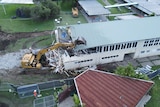 Rocklea State School building being demolished after being damaged by flood in February 2022.