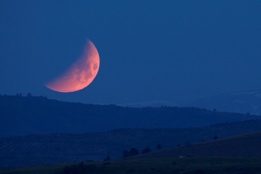 The moon is seen during lunar eclipse in Skopje, North Macedonia.