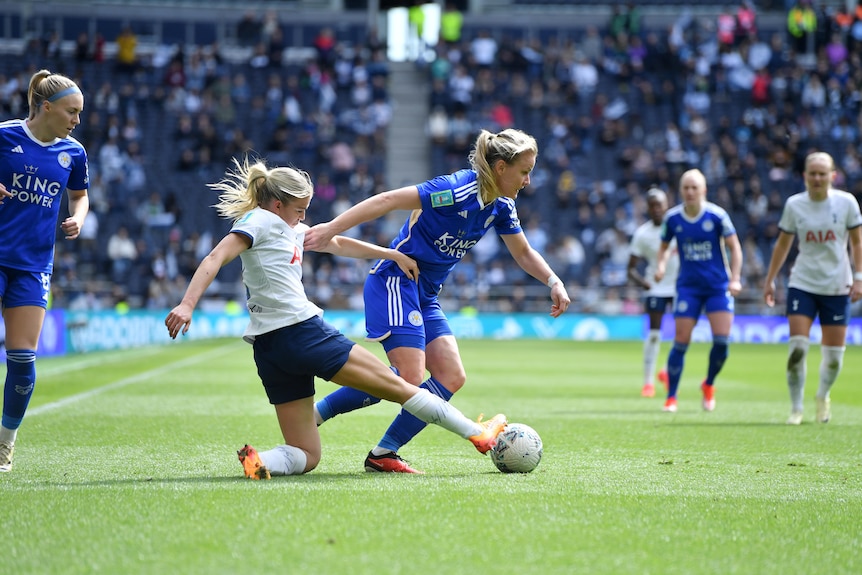 Charli Grant of Tottenham tackles Lena Petermann of Leicester City.