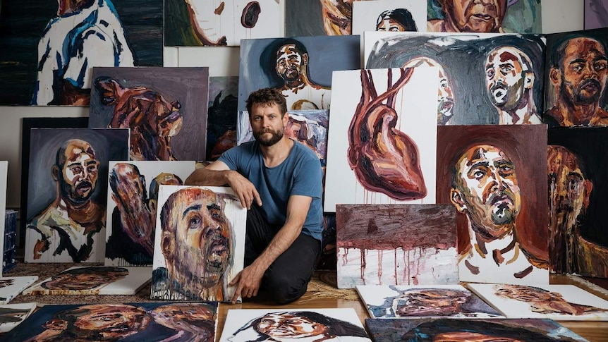 Artist Ben Quilty with paintings by Myuran Sukumaran