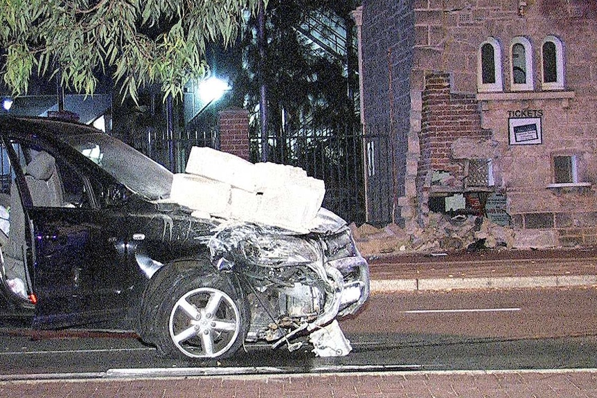 The damaged car and entrance gates at Subiaco Oval.