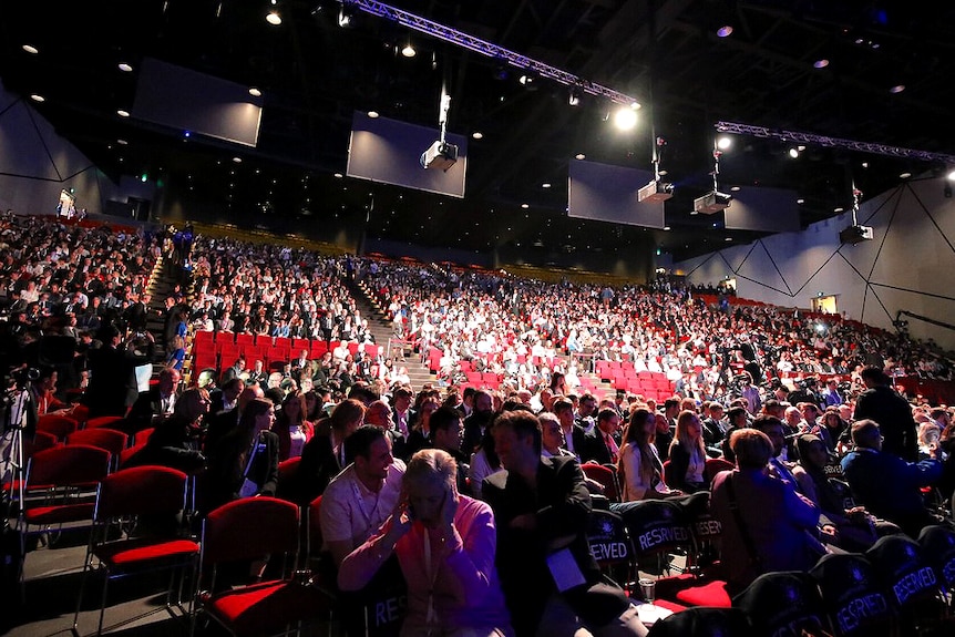 A large theatre full of people