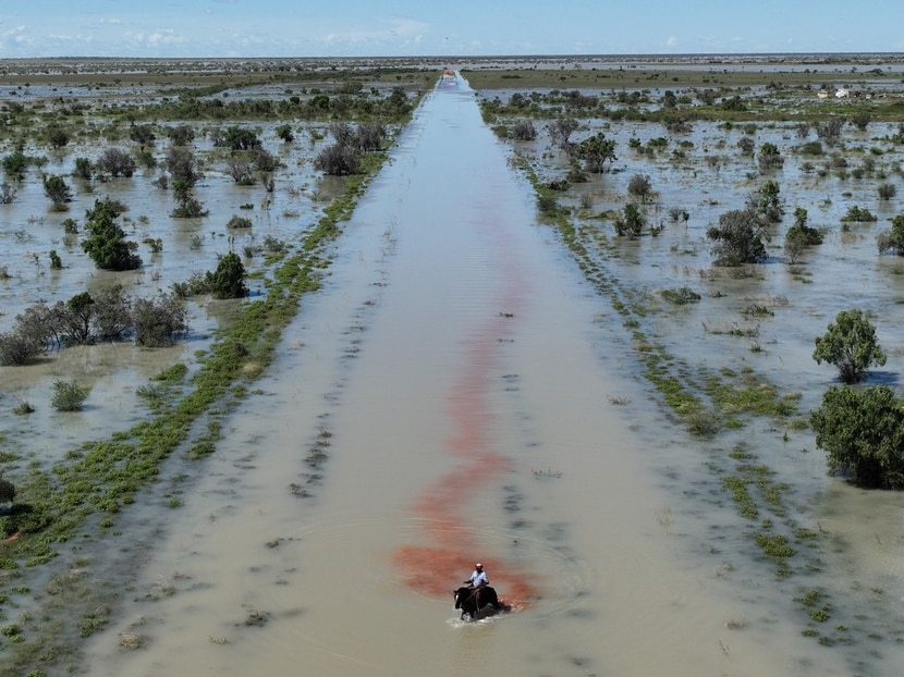 Man on horse in flood water