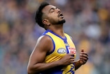 Willie Rioli with his eyes closed in disappointment.