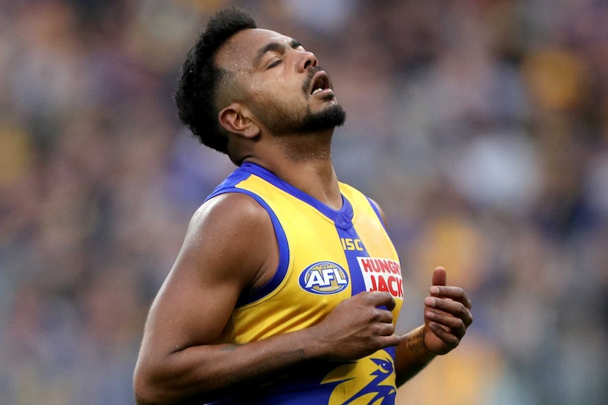 Willie Rioli with his eyes closed in disappointment.